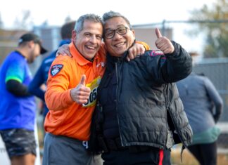 Two people pose for a photo at the Calgary Police Classic Run YYC