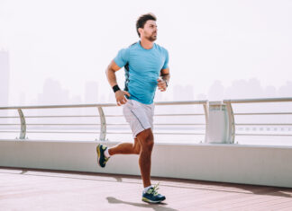 What Is a Recovery Run? Recovery Run - Man running on a sidewalk